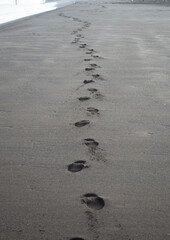 some footprints of a walker on a beach on the coast of Chile