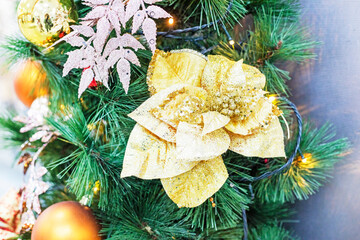 decorative New Year's decoration with artificial flowers and balls.Preparing for Christmas