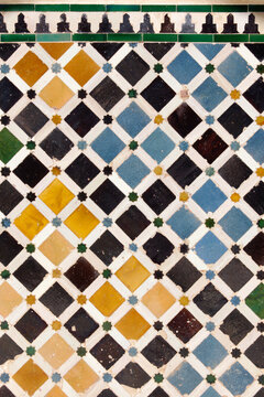 Granada (Spain). Architectural detail of the tiles on the fa&ccedil;ade of the Cuarto Dorado of the Palacio de Comares inside the Nasrid Palaces of the Alhambra in Granada