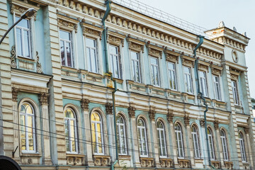 Fototapeta premium A beautifully detailed building in Irkutsk displays classic architecture with ornate moldings and large windows.