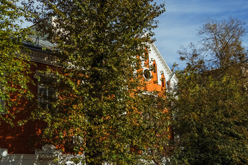 Beautiful brick facade of a building in Irkutsk, showcasing architectural style amidst autumn...