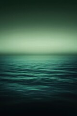 Obraz premium Serene green ocean waves under a tranquil twilight sky, creating a soothing and calm atmosphere.
