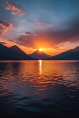 Sunset over water with mountains