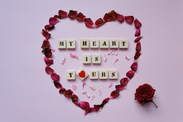 Obraz premium Heart-shaped rose petals and 