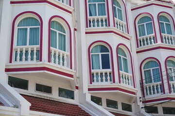 Detailed view of windows, doors and balconies of city buildings 