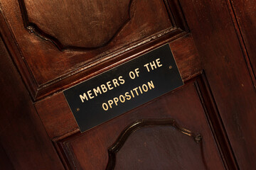 Members of opposition sign on the old wooden door in the Grandmaster Palace that used to hold the...