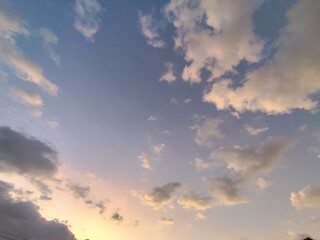 Fototapeta premium clouds in the blue sky at sunset time, beautiful nature background