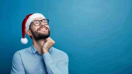 Happy man wearing Santa hat looking up and thinking about Christmas gift ideas, festive mood, preparing for holiday season with creative gift ideas and excitement