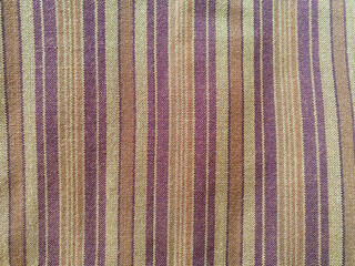 textured woolen spun fabric featuring a harmonious interplay of thin and thick woven vertical lines...
