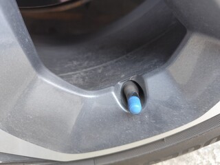 Close-up of a car air pump, focusing specifically on air filling.
