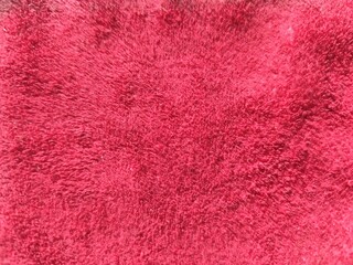 close up of red terry towel texture for background. Top view.
