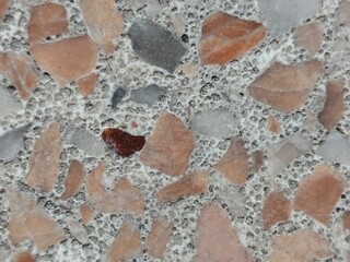 Terrazzo flooring texture. Closeup of polished stone surface.
