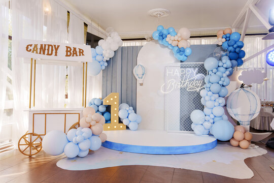 Little boy baby birthday decor with white and blue balloons. party decorations.