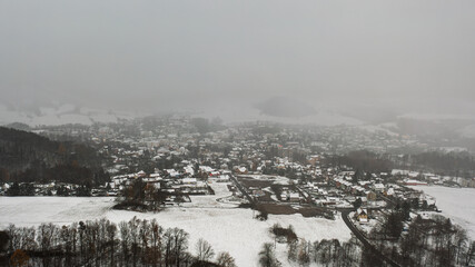 snow covered town. town Ceska kamenice, Czech republic.