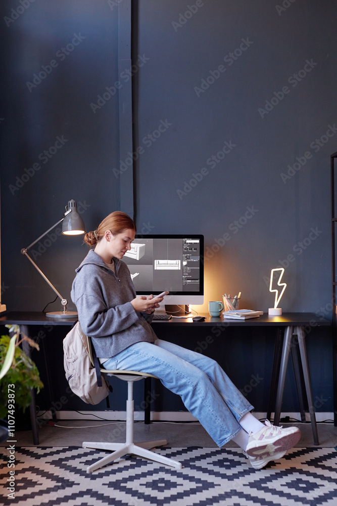 Aufkleber person engrossed in laptop with desk displaying computer monitor, books, and lightning shape lamp si