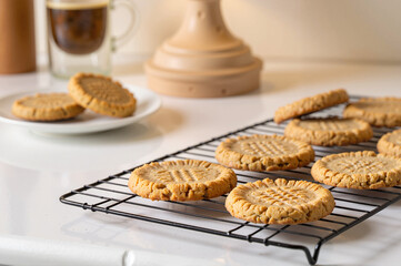 Low-carb peanut butter cookies cooling on a rack