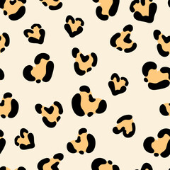 Fototapeta premium Cute leopard spots heart seamless pattern. Vector hand drawn brown animal leo skin print. Safari spotted texture background for fashion love print, fabric, textile, Valentines day decor, backgrounds.