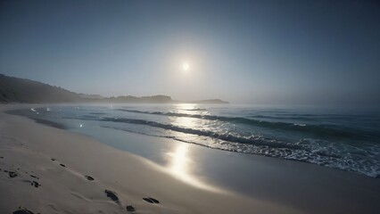 Obraz premium A calm beach with gentle waves and a clear sky