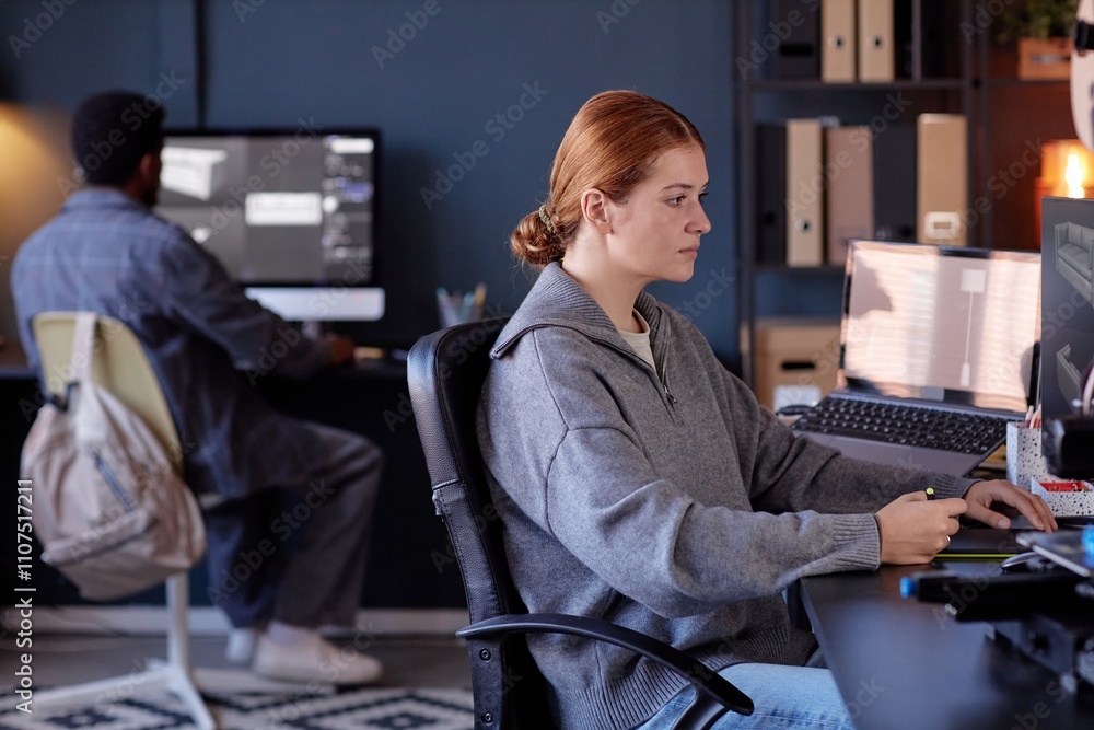 Poster two professionals working in modern office environment, focusing on computer screens, completing tas