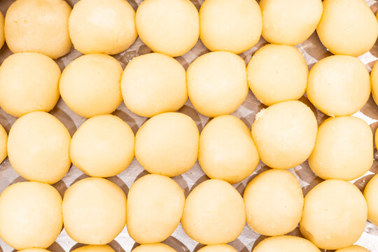 Dry rasgulla or Roshogolla closeup top view of indian, pakistani and bangladeshi sweet dessert