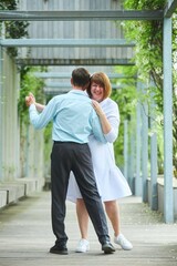 An adult bride and groom. Husband and wife's wedding anniversary photo shoot. We've been together for 30 years.