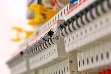 Automatic current switches to protect electrical loads. Soft focus.