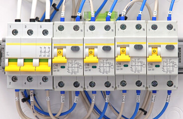 Automatic current switches to protect electrical loads. Soft focus.