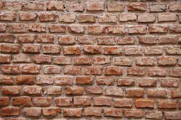Obraz premium Red brick wall background. Texture. Rustic clay brick wall industrial style.