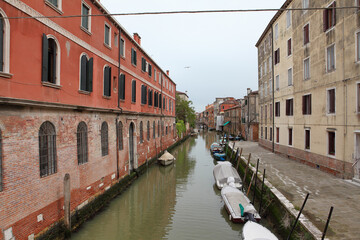 Cloudy day. Away from the tourist crowds in Venice, there are many beautiful neighborhoods to explore with much less boat traffic
