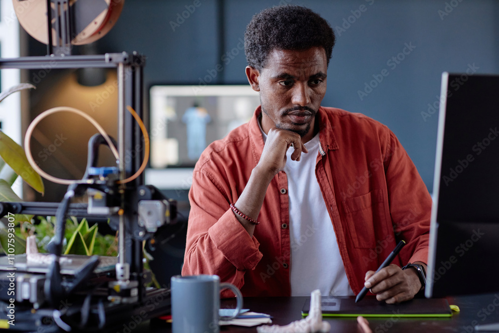 Leinwandbilder portrait of african american engineer working with 3d printer equipment while looking at monitor, fo