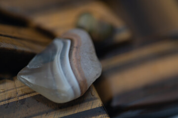 artistic wallpaper of close up of gemstones like tiger's eye, selenite, chalcedone; formed of amphibole and crocidolite fibers