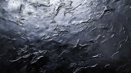 Fototapeta premium Metallic grey fluid surface with ripples and abstract dark textures, offering a contemporary design perfect for backgrounds with an industrial aesthetic.