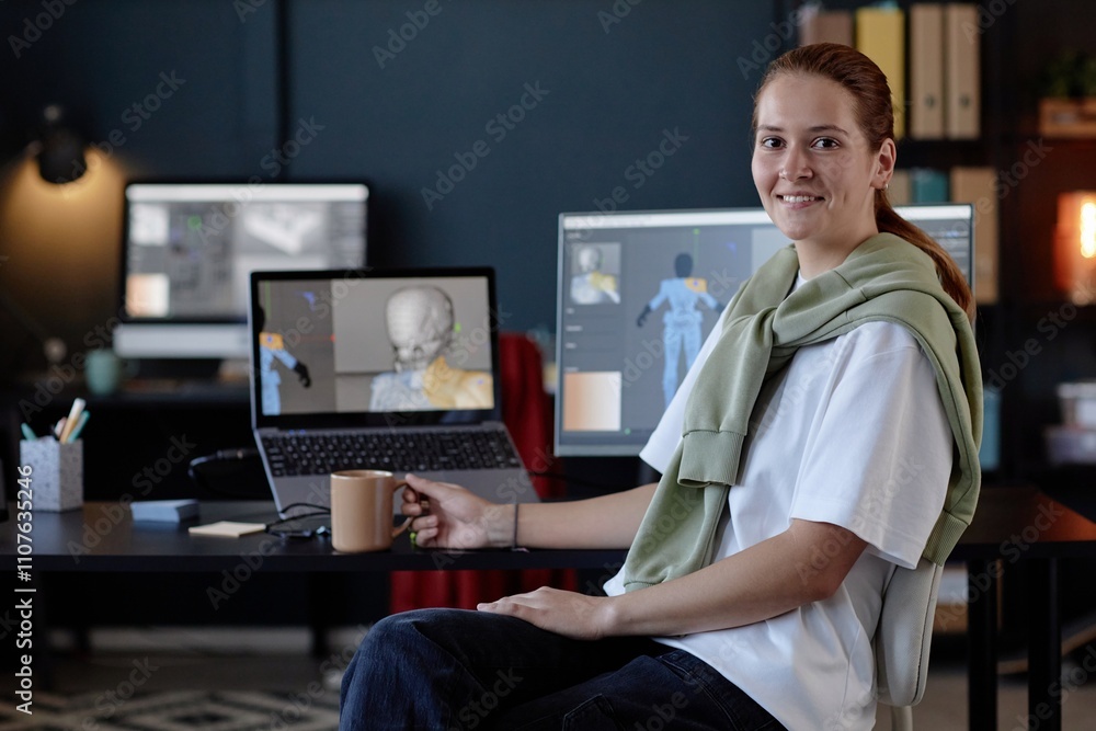 Poster portrait of smiling woman working at desk with dual computer screens in modern office. spacious and 
