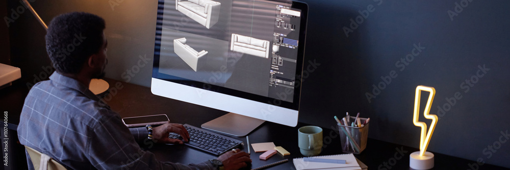 Poster man sitting at desk, analyzing 3d architectural models on computer screen, surrounded by office supp