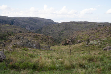 Obraz premium Idyllic rural landscape. Panorama view of the grassland and hills