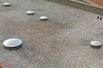 Many Plastic Cover Skylight Window at Gravel Industrial Flat Roof Structure