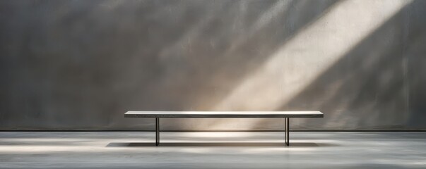 A minimalist scene featuring a simple bench illuminated by soft rays of light against a textured wall.
