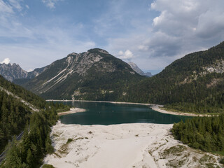 Obraz premium Aerial view of Lago del Predil, Lake Predil in the Alpine part of Italy