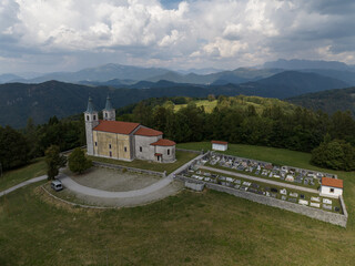Aerial view of Marijino Celje church near Gorenja vas, Soca valley, Slovenia