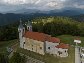 Aerial view of Marijino Celje church near Gorenja vas, Soca valley, Slovenia