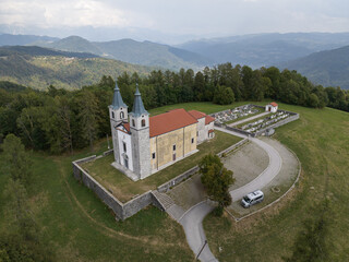 Aerial view of Marijino Celje church near Gorenja vas, Soca valley, Slovenia