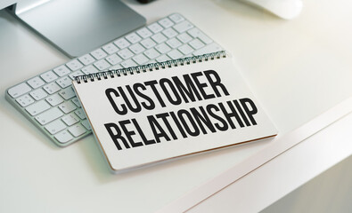 Notebook with Toolls and Notes about Customer Relationship