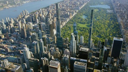 
Amazing Panoramic Aerial View of Billionaires Row in 57th and 59th street Midtown Manhattan. Supertall Skyscrapers. Central Park and its ponds and Lawns. High Quality Content Shot from Helicopter.