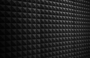 wide dark black acoustic foam wall in recording studio. Sound proofing for music recording, podcast...