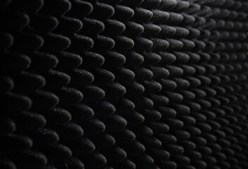 Dark sound proof foam with lighting. Acoustic foam texture background