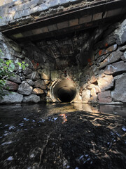 The underground drainage collector pipe comes to the surface.