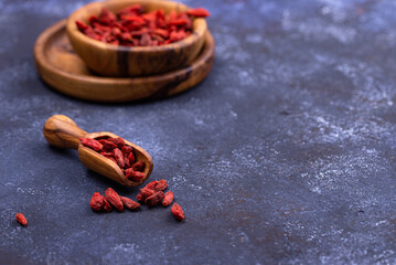 Goji berries on blue background