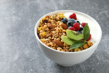 Delicious granola with berries and yogurt on the table