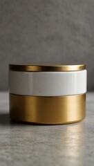 Modern container with a gold lid, minimalist elegance.