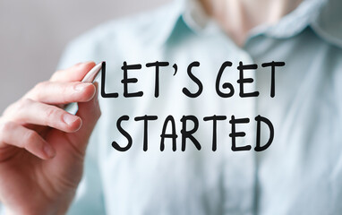 Hand writing text Let's Get Started. Business Concept.